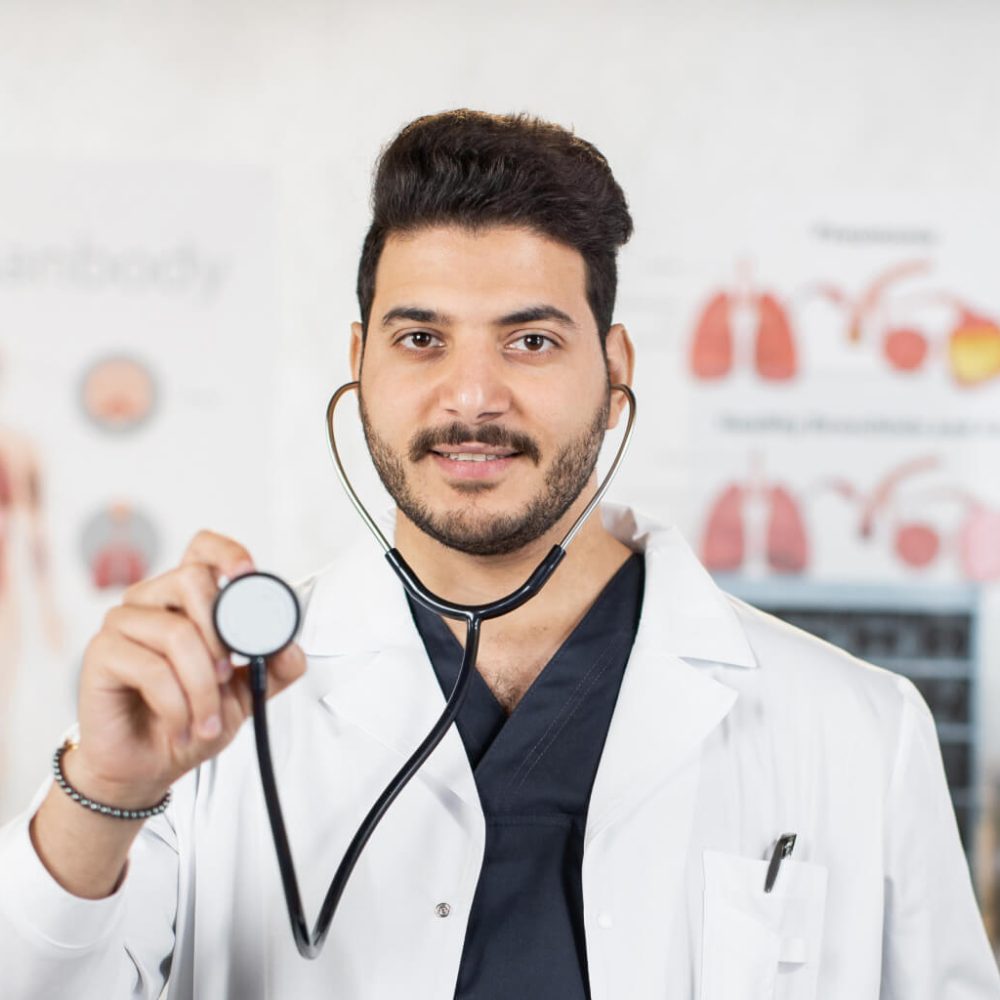 indian-doctor-holding-stethoscope-and-smiling-on-c-2023-11-27-05.jpg indian-doctor-holding-stethoscope-and-smiling-on-c-2023-11-27-05.jpg