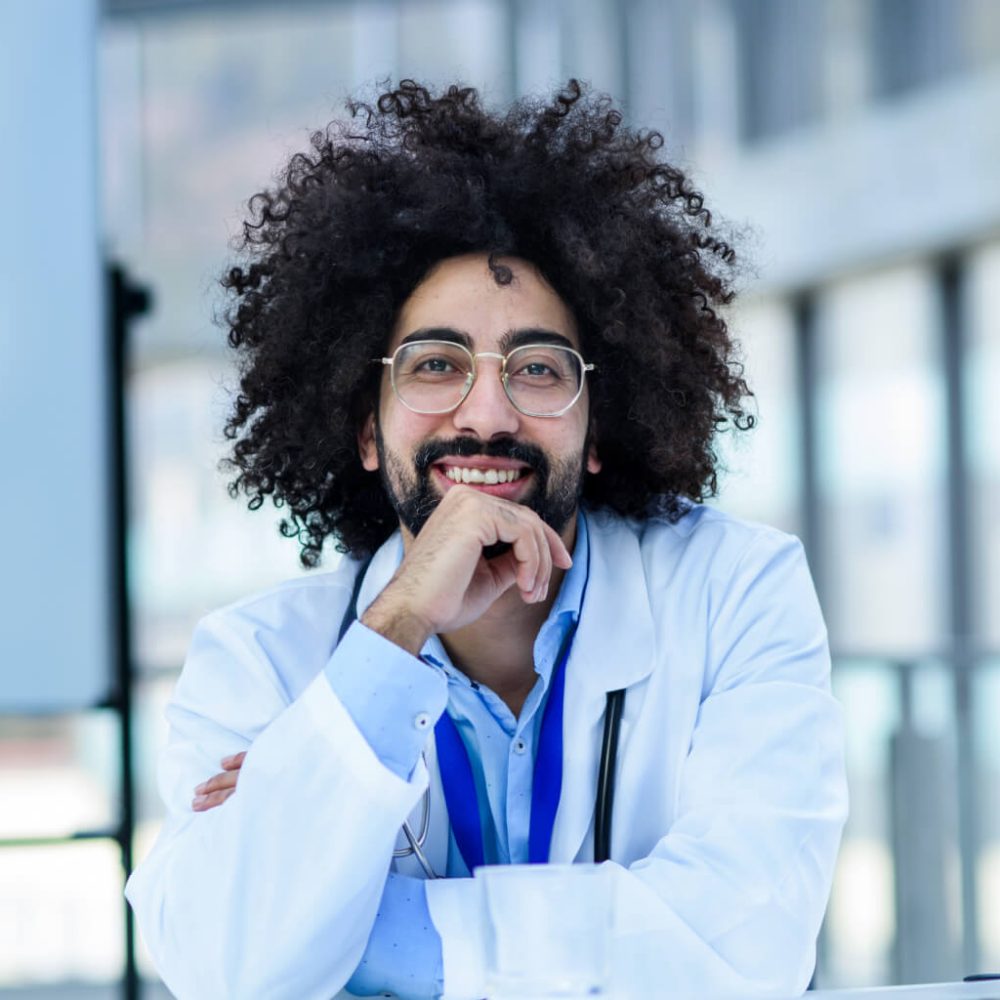 portrait-of-cheerful-male-doctor-sitting-in-hospit-2024-10-18-08-58.jpg portrait-of-cheerful-male-doctor-sitting-in-hospit-2024-10-18-08-58.jpg